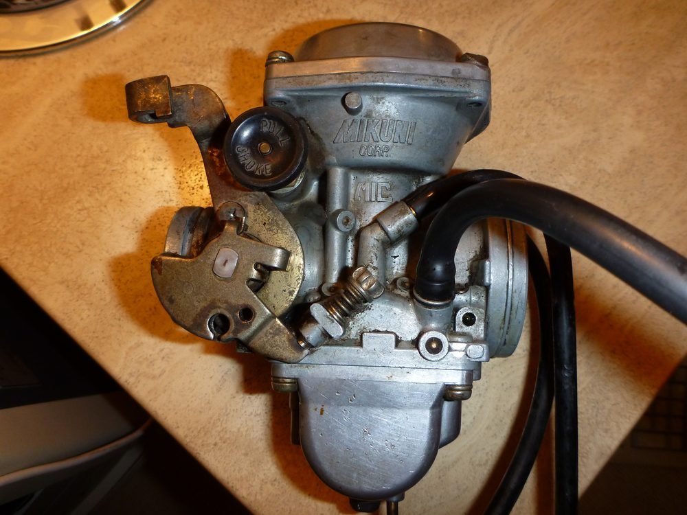 Mikuni carburator being rebuilt