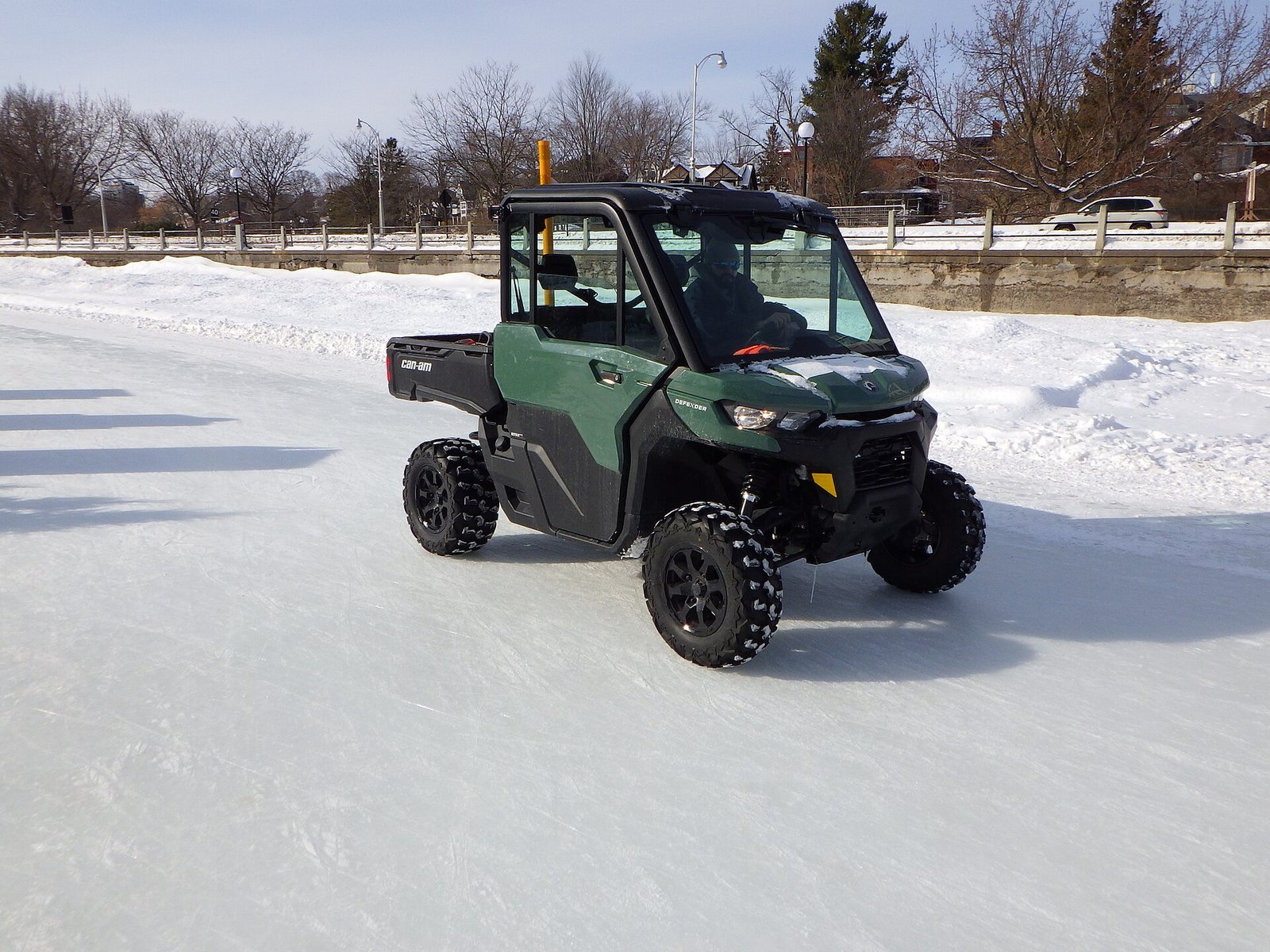 Can-Am Defender side-by-side parked on snow