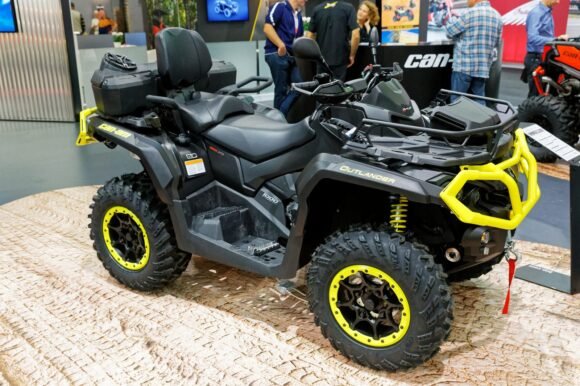 Can-Am Outlander 1000R X mr ATV with windshield and cargo rack, displayed at the 2018 Paris Motor Show