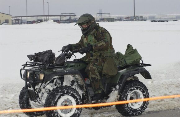 Honda Rancher ATV ridden through snow on an off-road trail