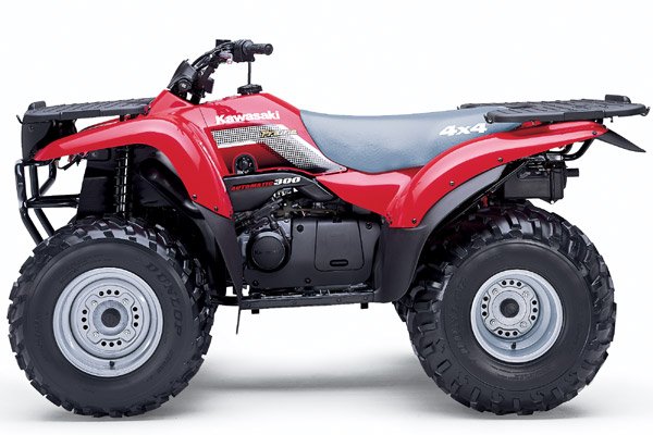 Red and black Kawasaki Prairie 300 4x4 utility ATV with cargo racks against a white studio background
