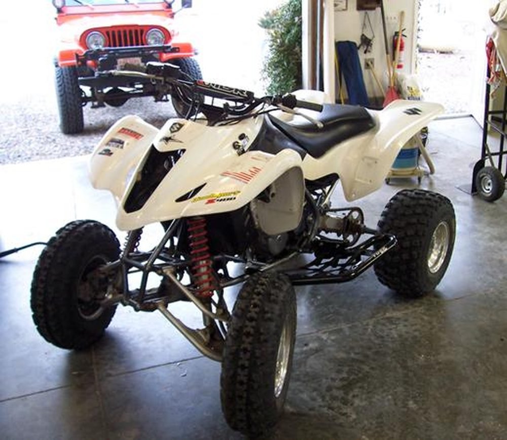 2004 Suzuki LTZ 400 sport ATV in a garage