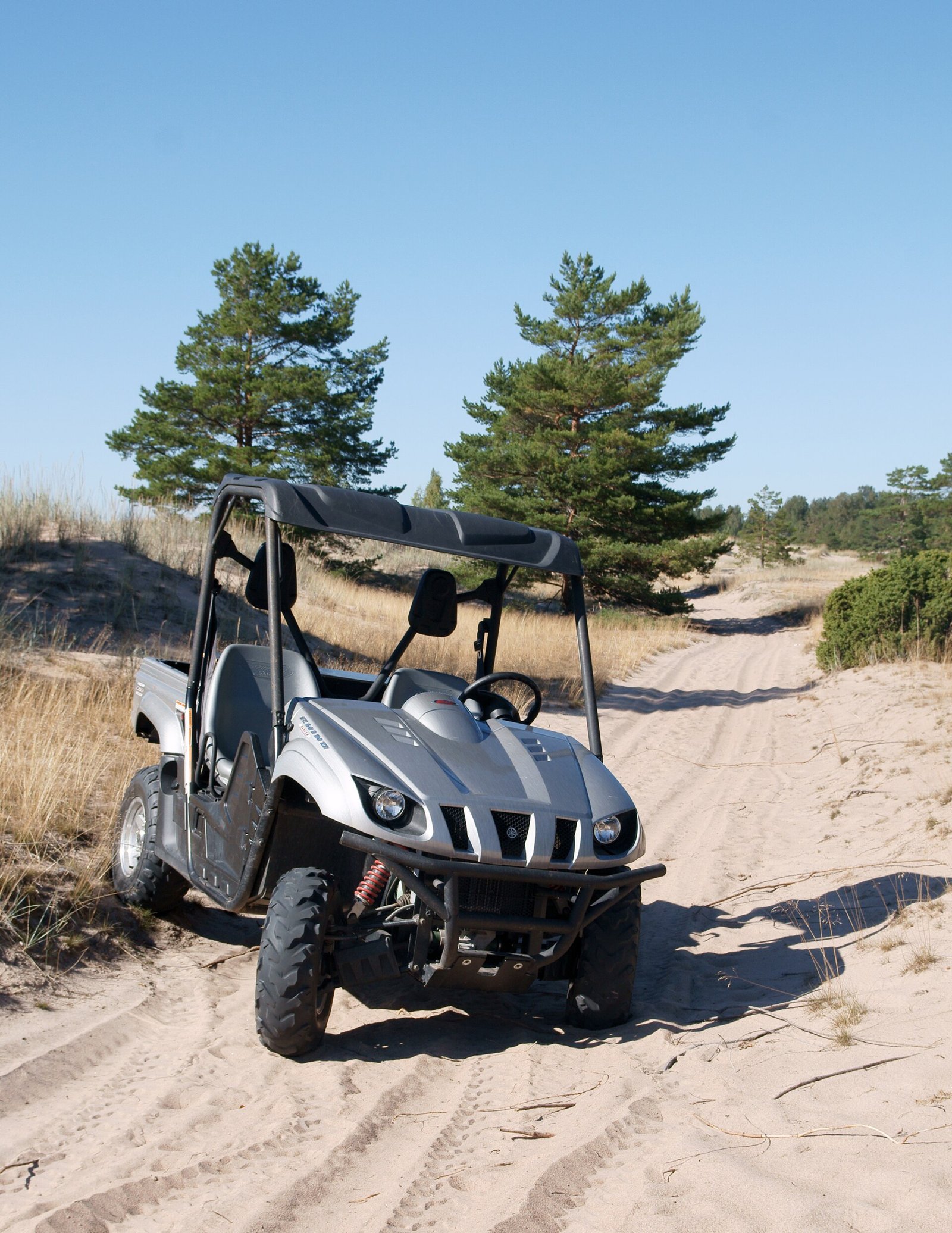 Yamaha Rhino side-by-side on a sandy trail