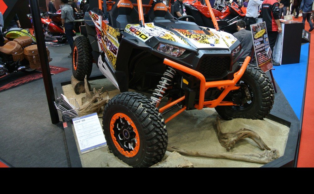 Polaris RZR XP 1000 sport side by side showing its long travel suspension